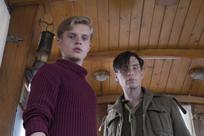 Tom Glynn-Carney and Cillian Murphy in Dunkirk, looking at the floor