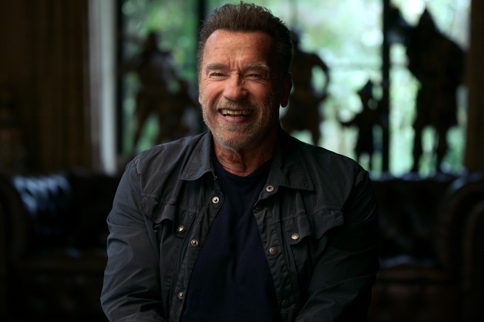 Arnold Schwarzenegger in Arnold, laughing