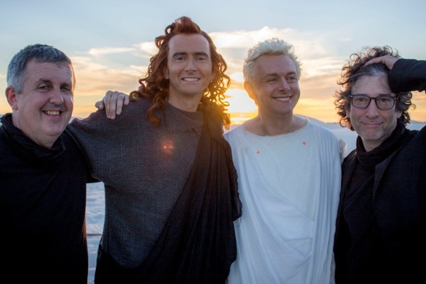 The team behind Good Omens, including David Tennant and Michael Sheen, smiling and embracing