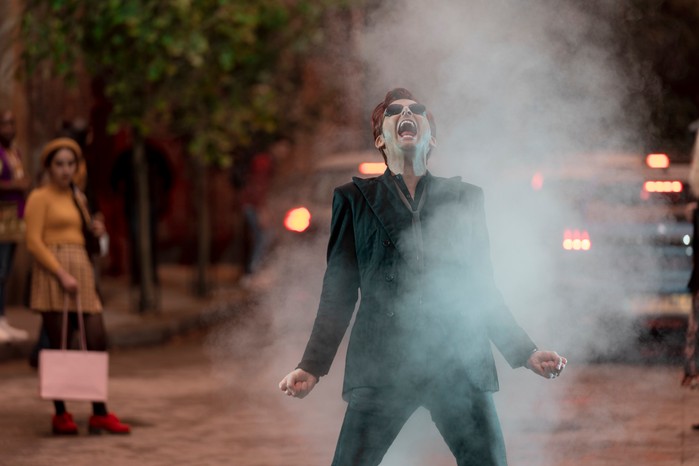David Tennant as Crowley in Good Omens season 2, standing in a cloud of smoke