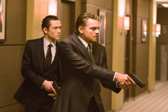 Joseph Gordon-Levitt and Leonardo DiCaprio in Inception, holding guns