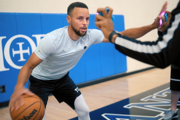 Steph Curry holding a basketball in Apple TV+ documentary Stephen Curry: Underrated