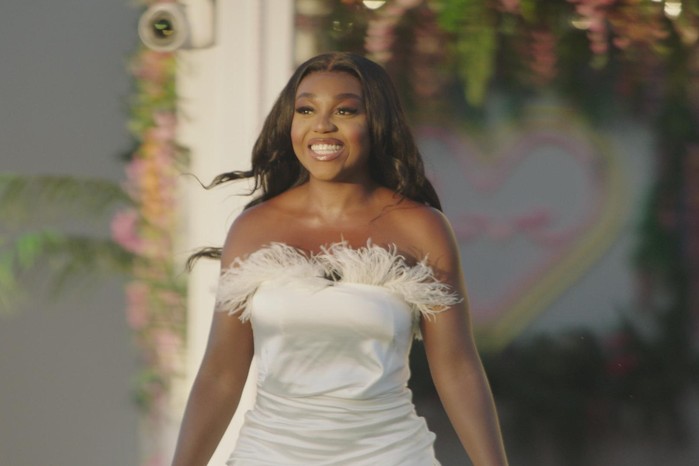 Whitney Adebayo attends the Love Island 2023 prom, wearing a white dress